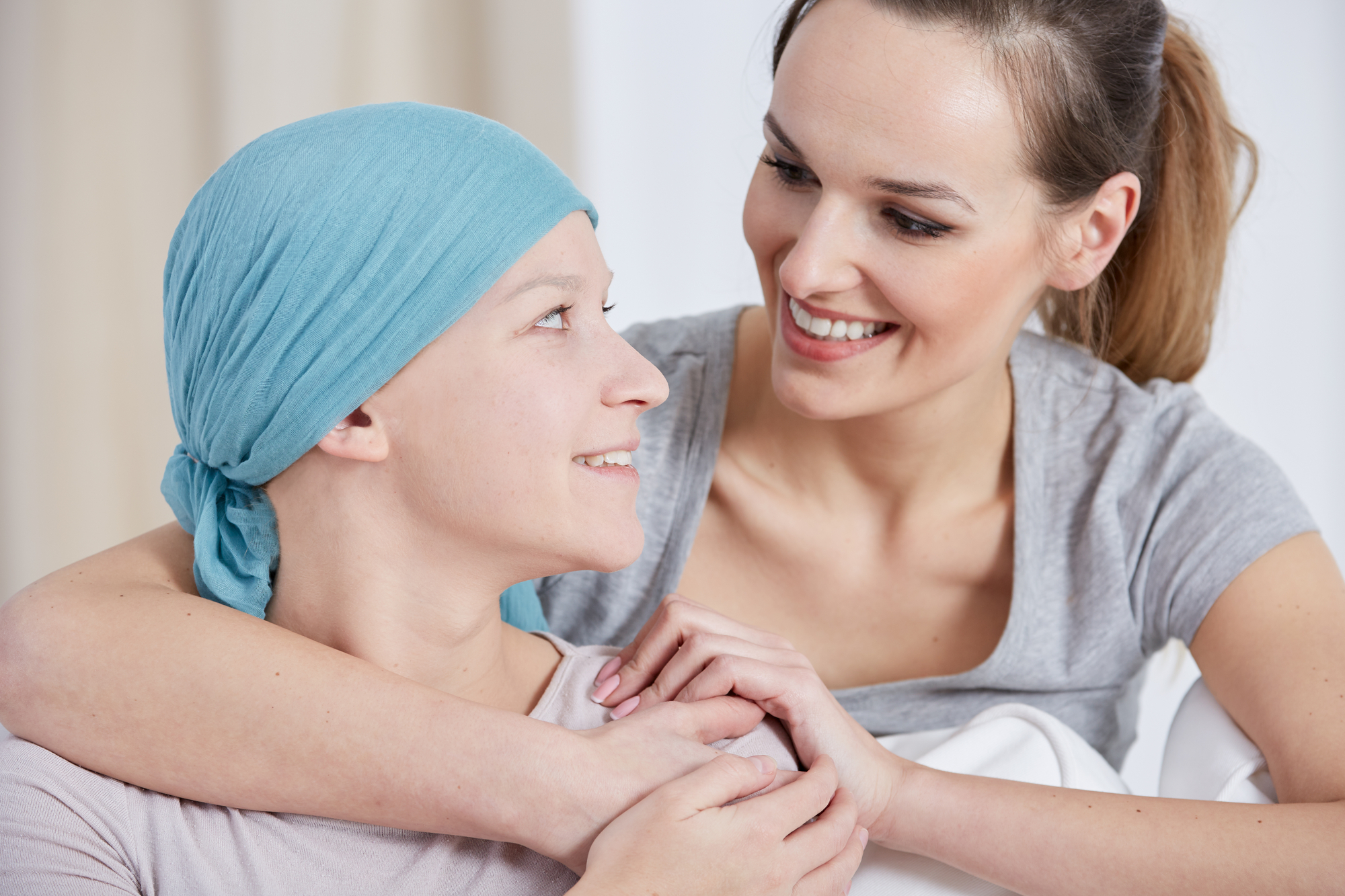 Hopeful Cancer Woman Wearing Headscarf With Her Mother